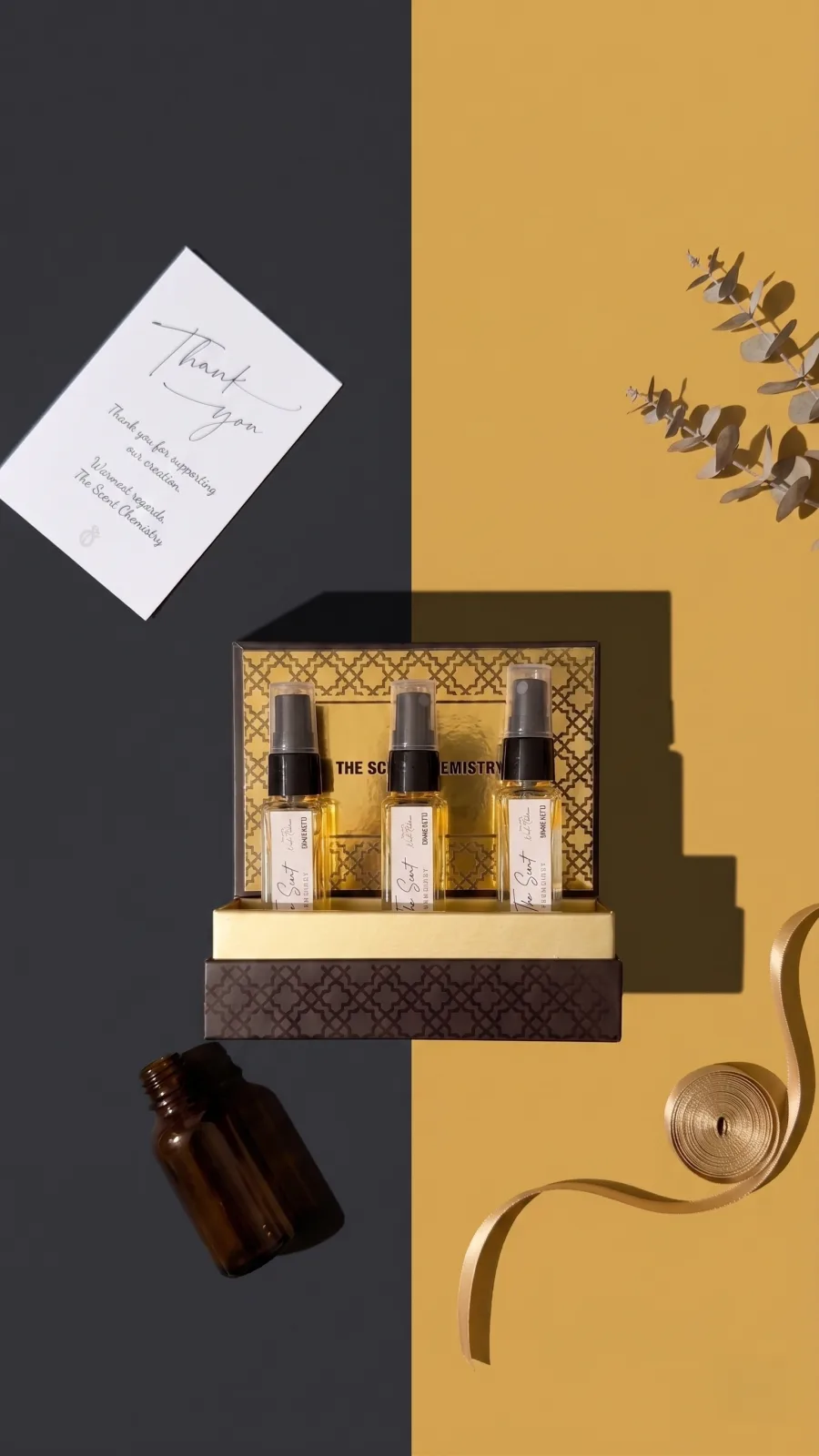 Perfume discovery set in gold presentation packaging